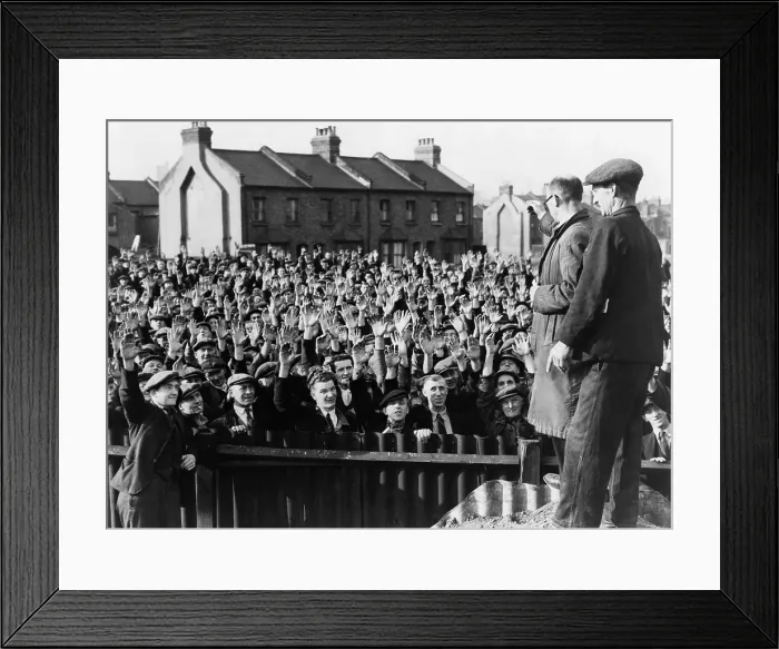 Framed Print : Strikers at the Royal Albert Docks, London, raising their hands in a vote of confidence for strike leader Thomas Powell, seen in right foreground, wearing glasses. 1945