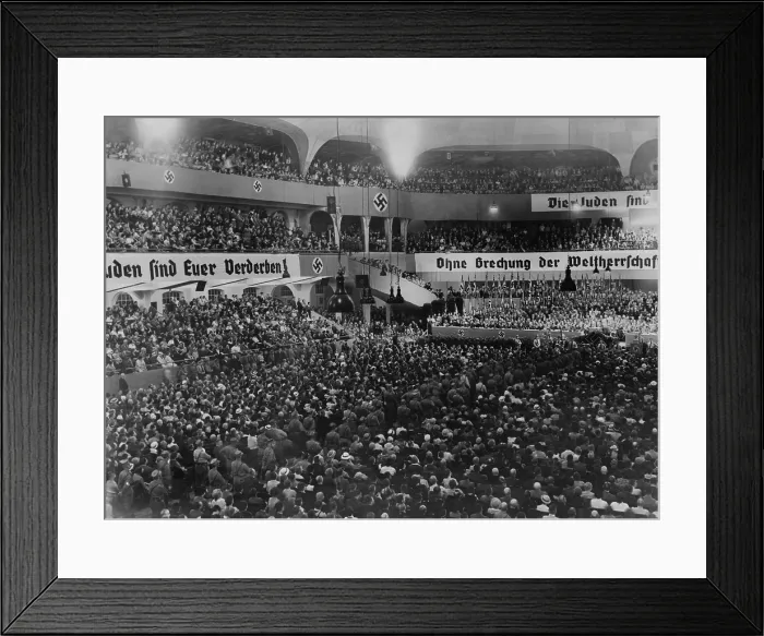 Framed Print : Anti-Semitic rally, with swastikas and anti-Semitic banners, at the massive auditorium of Sportpalast, Berlin, where Nazi propagandist, Julius Streicher, would speak on August 16
