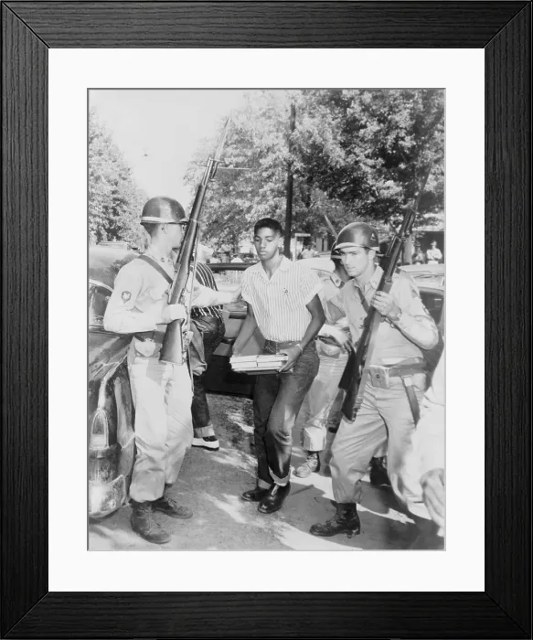 Framed Print : An African American student is escorted to a waiting car by National Guard troops enforcing school integration in Sturgis, Kentucky. Sept 1956 Framed Print : An African American student is escorted to a waiting car by National Guard troops enforcing school integration in Sturgis, Kentucky. Sept 1956