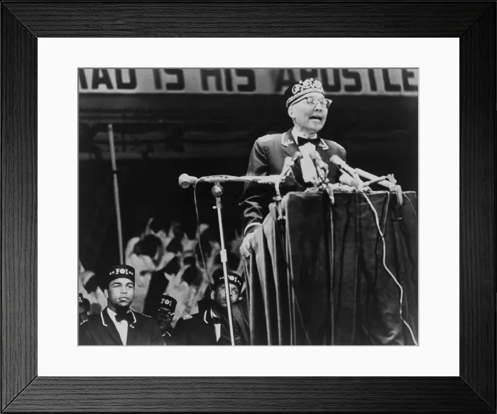 Framed Print : Elijah Muhammad, leader of the Black Muslims, addressing a convention in Chicago. World champion boxer, Muhammad Ali, sits on the left. 1967