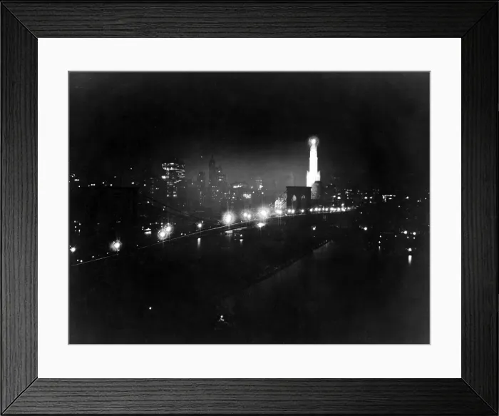 Framed Print : New York City. Night view of New York by Sperry searchlight, skyline from East River. Photograph, March 31, 1919