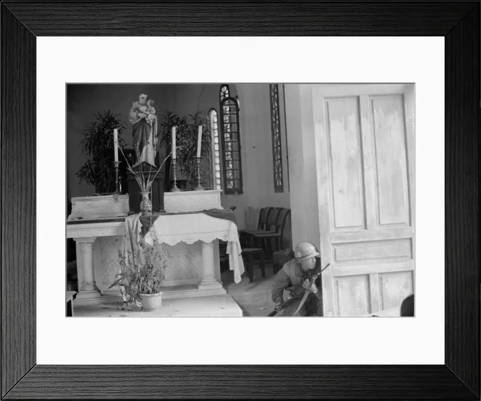 Framed Print : Vietnam War-Tet Offensive. US Marine crouches behind a church door during the Battle of Hue. Feb. 9, 1968