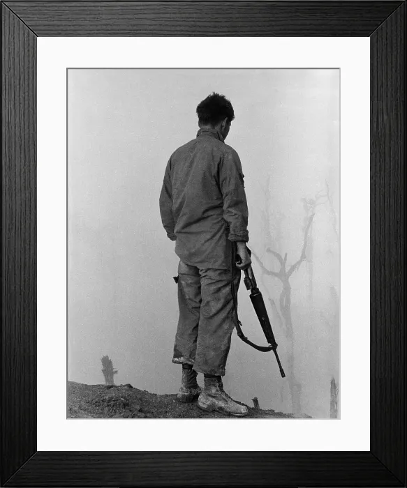 Framed Print : Vietnam War. US Infantryman looks over the fog-shrouded A Shau Valley, a major arm of the Ho Chi Minh Trail. 1969