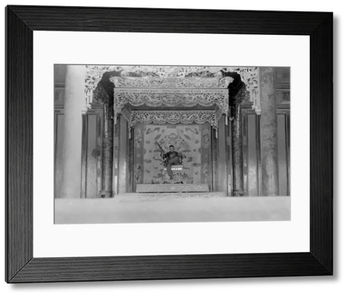 Framed Print : Vietnam War-Tet Offensive. US Marine Sergeant sits on a throne in the palace in the old city of Hue. The Battle of Hue lasted over 30 days. February 24, 1968