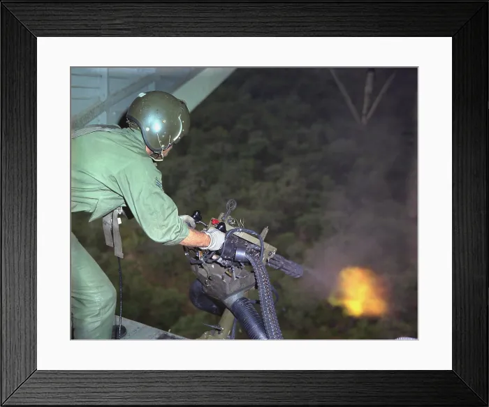 Framed Print : Vietnam War. US Air Force helicopter door gunner fires a mini-gun during a rescue patrol over South Vietnam. Oct. 10, 1968 Framed Print : Vietnam War. US Air Force helicopter door gunner fires a mini-gun during a rescue patrol over South Vietnam. Oct. 10, 1968