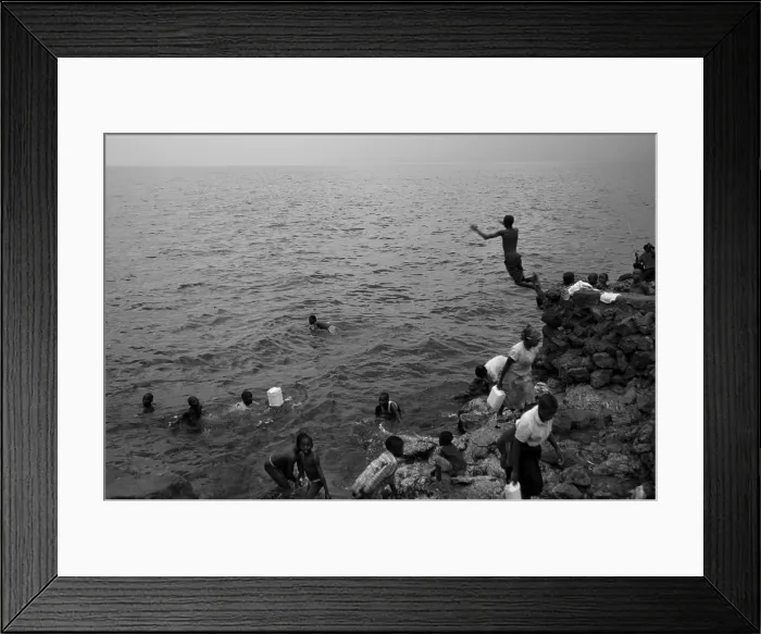 Framed Print : CONGO, Democratic Republic of the. NORTH KIVU. Democratic Republic of the Congo (2008). Kivu Conflict. Bathers in Lake Kivu. AISA / Everett Collection**US SALES ONLY**