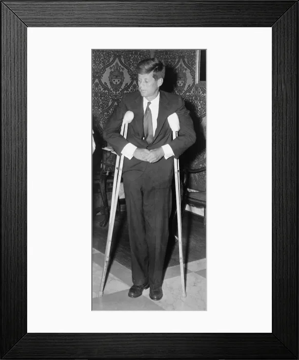 Framed Print : President John F. Kennedy (1917-1963), standing with crutches on June 12, 1961 Framed Print : President John F. Kennedy (1917-1963), standing with crutches on June 12, 1961