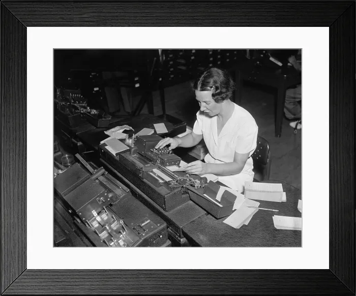 Framed Print : Social Security Administration clerk punching tabulator operation cards, with each hole representing a letter or a numbers Framed Print : Social Security Administration clerk punching tabulator operation cards, with each hole representing a letter or a numbers