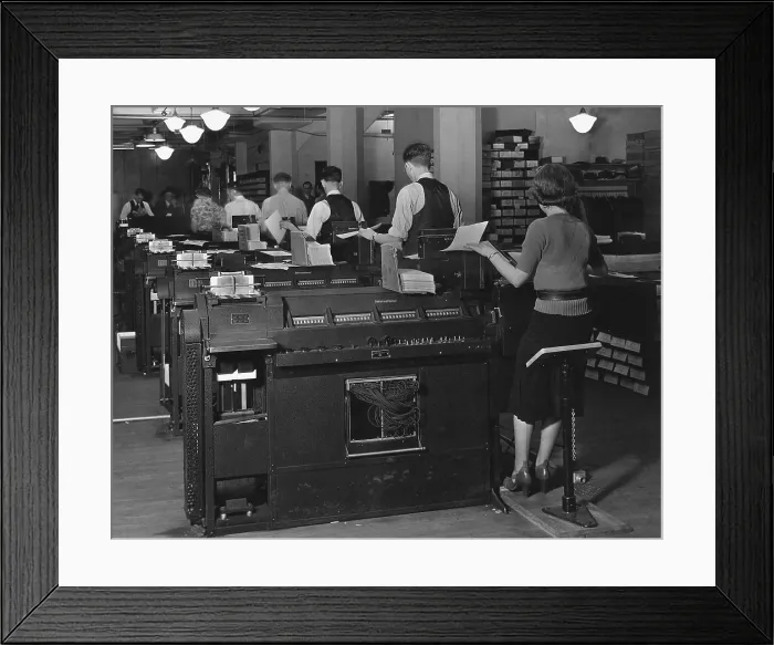 Framed Print : Social Security Administration clerks seated at massive tabulating machines, actually early computers