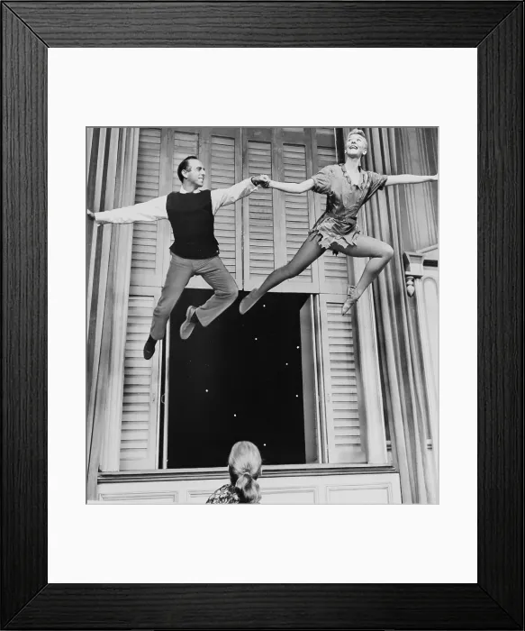 Framed Print : Mary Martin (1913-1990) and Director Jerome Robbins (1918-1998), flying onstage in rehearsal for a 1956 PETER PAN Television production Framed Print : Mary Martin (1913-1990) and Director Jerome Robbins (1918-1998), flying onstage in rehearsal for a 1956 PETER PAN Television production