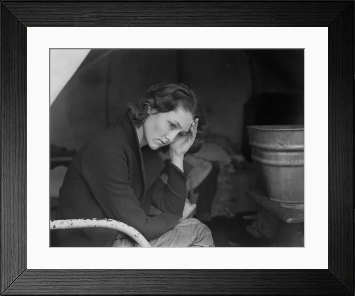 Framed Print : Sad daughter of unemployed Tennessee coal miner in California migrant workers camp near Sacramento, California, during the Great Depression. Photo by Dorothea Lange, 1936
