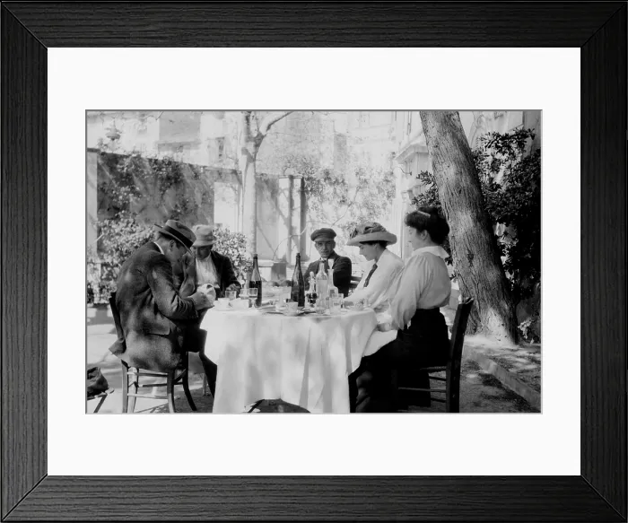 Framed Print : Francis Picabia (1879-1953), French painter, (center) with friends at an outdoor caf. Ca. 1915