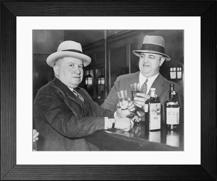 Framed Print : Izzy Einstein (left) sharing a toast with his partner, Moe Smith in a New York bar in 1935