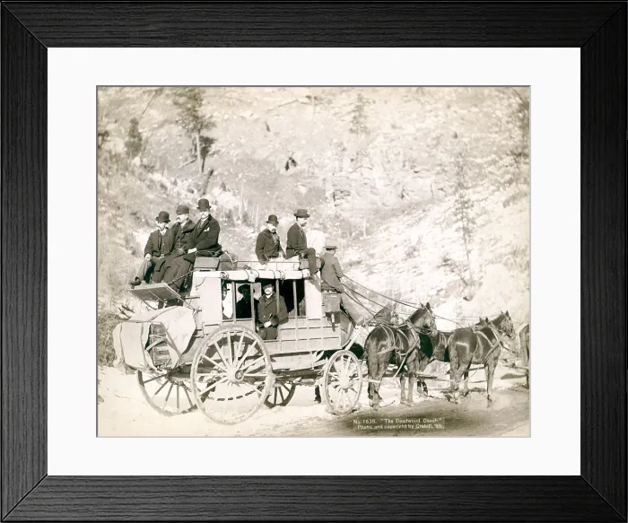 Framed Print : The Deadwood Coach. Side view of a stagecoach; formally dressed men sitting in and on top of coach. Deadwood, SD. John C. Grabill, 1889 Framed Print : The Deadwood Coach. Side view of a stagecoach; formally dressed men sitting in and on top of coach. Deadwood, SD. John C. Grabill, 1889
