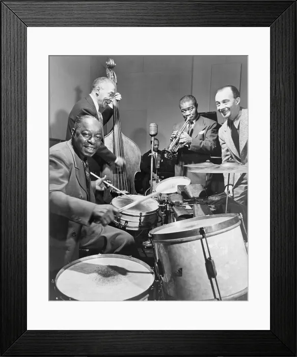 Framed Print : Louis Armstrong (1901-1971), playing trumpet with others during a 1947 broadcast of 'This is Jazz' radio show, directed by Rudi Blesh (far right)