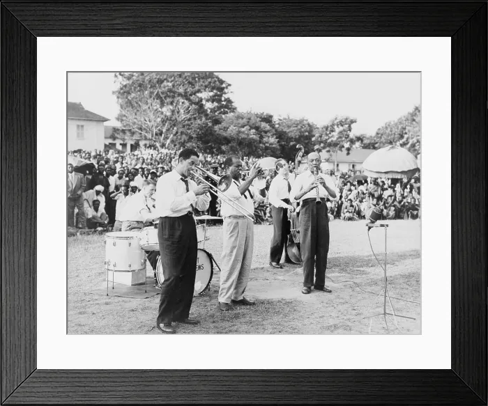 Framed Print : Louis Armstrong (1901-1971), African American Jazz musician, playing trumpet with band at an outdoor gathering in Africa, 1956
