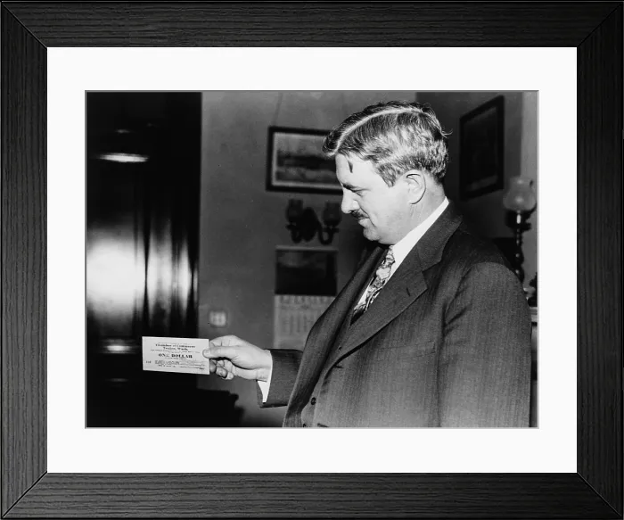 Framed Print : Senator Clarence C. Dill of Washington state, holding one of the wooden dollars used by town of Tenino, Washington Framed Print : Senator Clarence C. Dill of Washington state, holding one of the wooden dollars used by town of Tenino, Washington