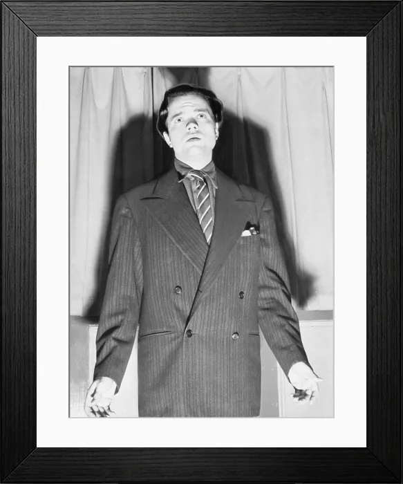 Framed Print : Orson Welles (1915-1985) with his shadow in an expressive portrait from 1938