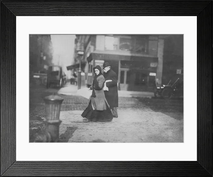 Framed Print : Woman carrying flowers home, West Houston Street, original caption: A short time ago she told me they were not going to make flowers any more, New York