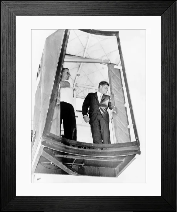 Framed Print : President John F. Kennedy riding a lift, called a cherry picker, to board plane flying from West Palm Beach, Fla. back to Washington, D.C