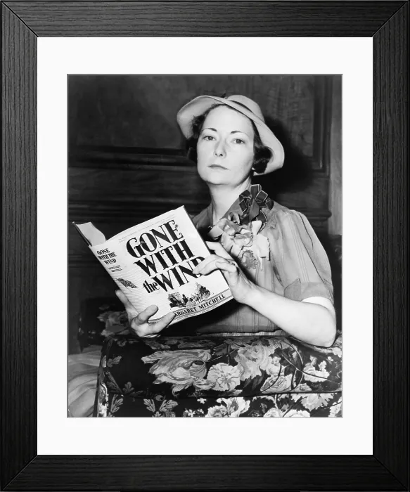 Framed Print : Margaret Mitchell (1900-1949), holding her novel, 'Gone with the Wind, ' the 1937 winner of the Pulitzer Prize Framed Print : Margaret Mitchell (1900-1949), holding her novel, 'Gone with the Wind, ' the 1937 winner of the Pulitzer Prize