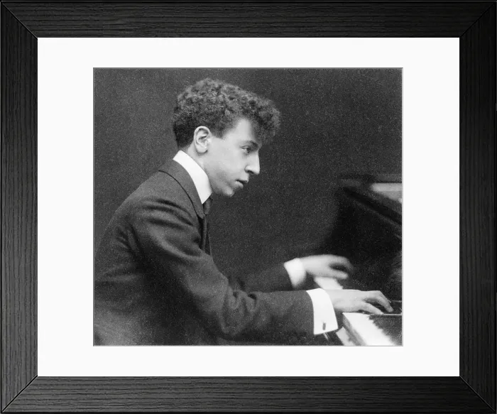 Framed Print : Young Artur Rubinstein (1887-1982), seated at piano 1906, the year the Polish pianist made his American debut at Carnegie Hall