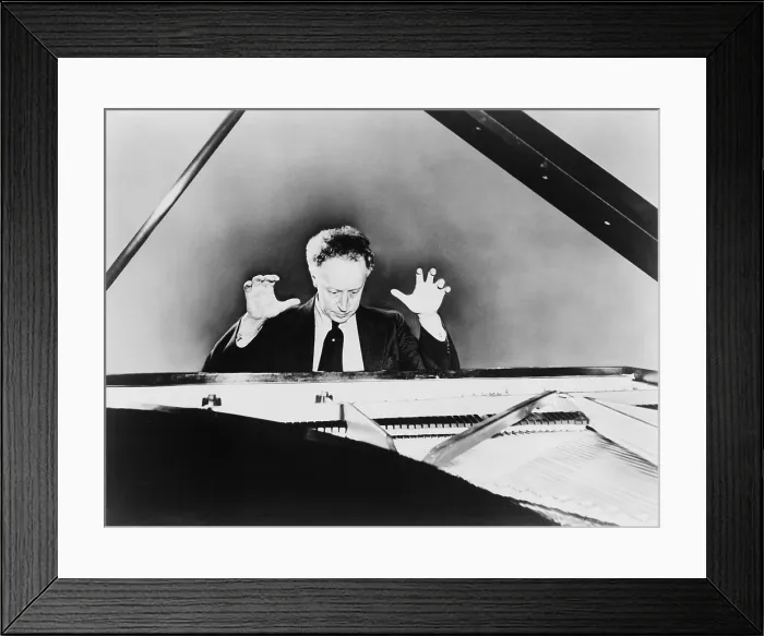Framed Print : Artur Rubinstein (1887-1982), a grand piano, with his hands raised in 1951. The Polish born pianist became an American citizen in 1946 Framed Print : Artur Rubinstein (1887-1982), a grand piano, with his hands raised in 1951. The Polish born pianist became an American citizen in 1946