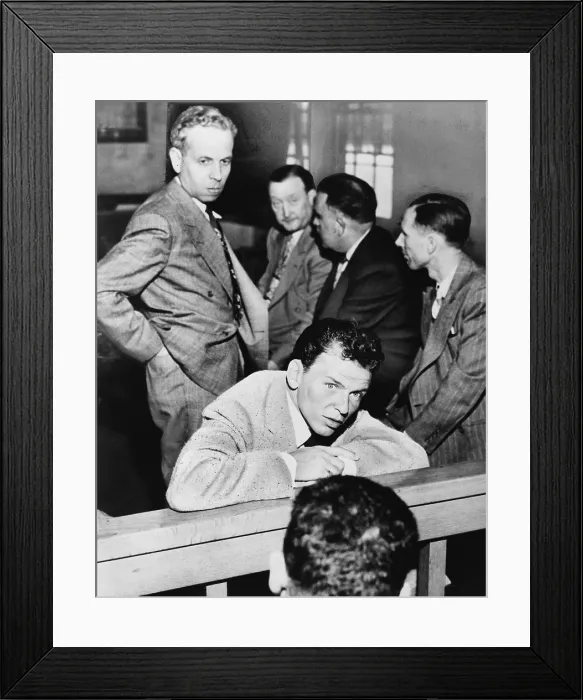 Framed Print : Frank Sinatra (1915-1998) talking with reporters during his trial for battery against journalist Lee Mortimer. Mortimer is behind Sinatra, on left side of photo. 1947 Framed Print : Frank Sinatra (1915-1998) talking with reporters during his trial for battery against journalist Lee Mortimer. Mortimer is behind Sinatra, on left side of photo. 1947