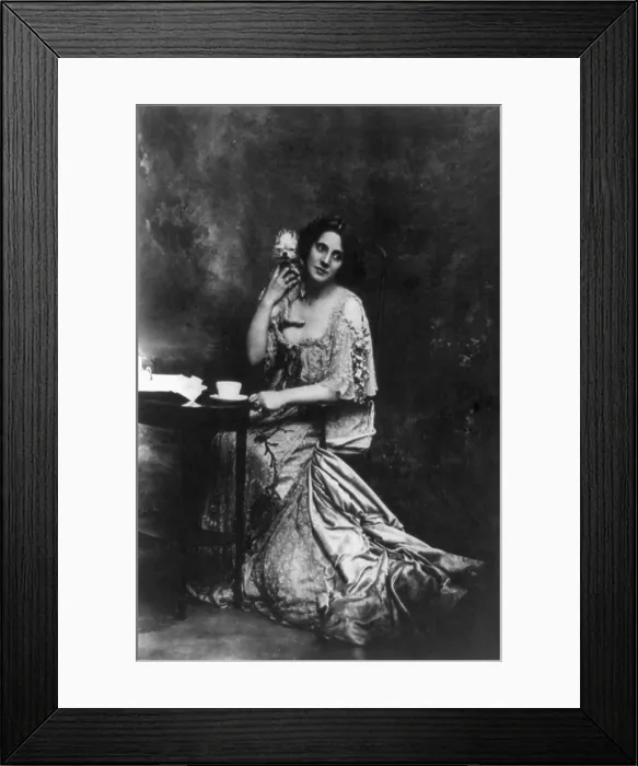 Framed Print : Mrs. Patrick Campbell, (1865-1940) English actress, holding pet dog. 1901