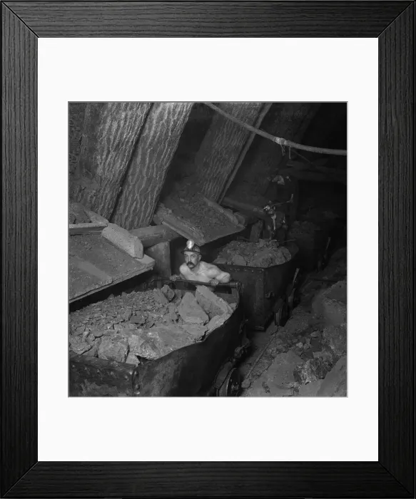 Framed Print : A miner working a mine underground, loading and handling cars with copper ore, Calumet-Hecla Mines, Calumet, Michigan. Ca. 1915 Framed Print : A miner working a mine underground, loading and handling cars with copper ore, Calumet-Hecla Mines, Calumet, Michigan. Ca. 1915