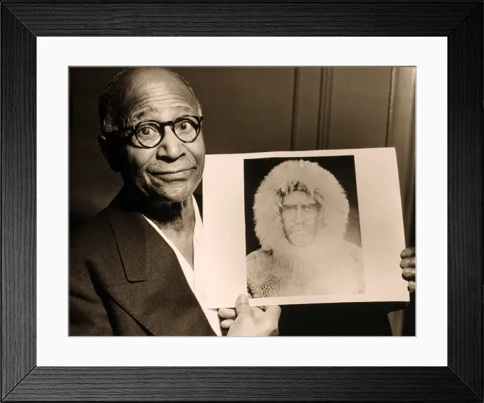 Framed Print : Matthew Henson (1866-1955), African American Arctic explorer, holding a portrait Admiral Robert E. Peary, his expedition leader. 1953