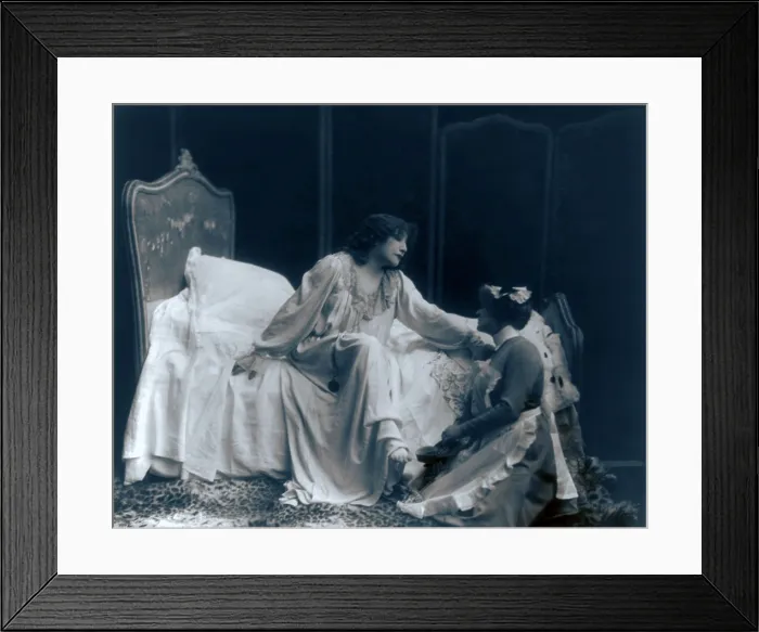 Framed Print : Sarah Bernhardt (1844-1923), French actress, in the role of the dying Camille, with her maid helping her put on her slippers. Ca. 1887 Framed Print : Sarah Bernhardt (1844-1923), French actress, in the role of the dying Camille, with her maid helping her put on her slippers. Ca. 1887