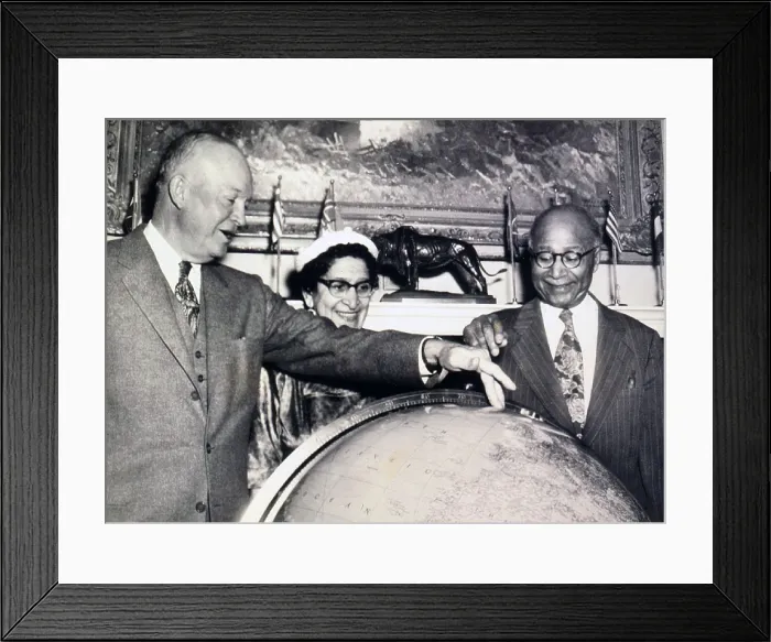 Framed Print : Matthew Henson (1866-1955), African American Arctic explorer, and President Eisenhower discuss the North Pole over a globe at the White House. Mrs. Robert L