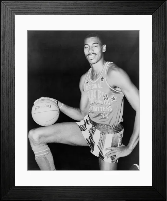 Framed Print : Wilt Chamberlain, wearing uniform of Harlem Globetrotters basketball team. 1959 Framed Print : Wilt Chamberlain, wearing uniform of Harlem Globetrotters basketball team. 1959