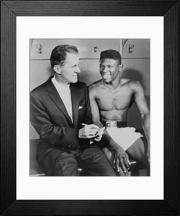 Framed Print : World welterweight champion Emile Griffith being interviewed by sportscaster, Dun Dunphy. 1961