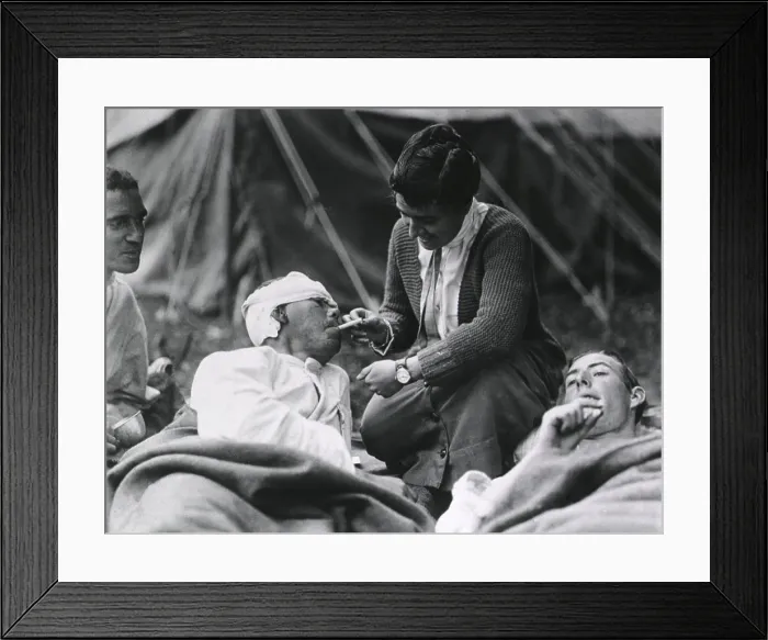 Framed Print : Red Cross Worker Miss Anna Rochester, of the Smith College Unit, helping a wounded soldier with his cigarette at the U.S Framed Print : Red Cross Worker Miss Anna Rochester, of the Smith College Unit, helping a wounded soldier with his cigarette at the U.S