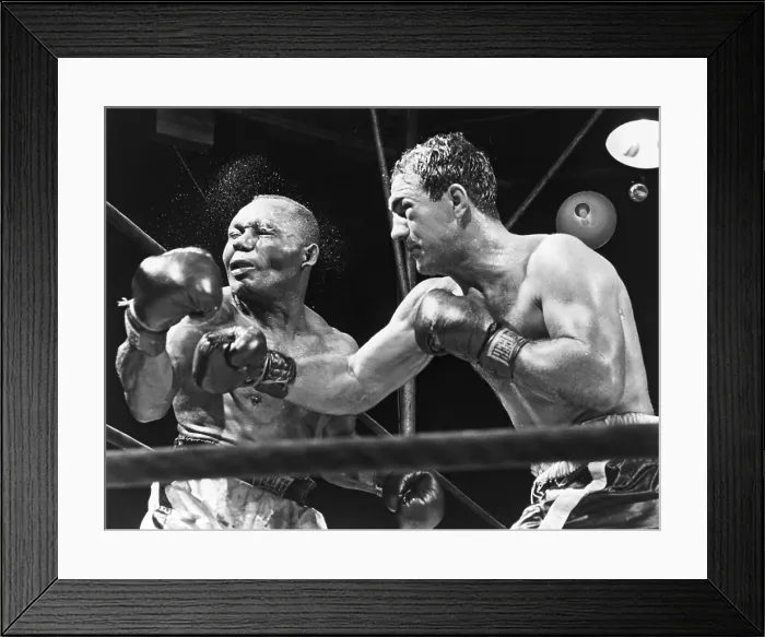 Framed Print : Rocky Marciano landing a punch on Jersey Joe Walcott during their Sept. 23, 1952 fight for the heavyweight championship