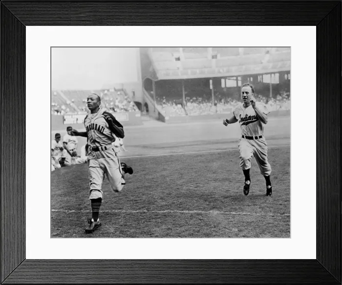 Framed Print : Jesse Owens beating baseball player George Case in 100-yard dash at Cleveland Stadium. Cash was baseball's faster player, and Jesse was the 1936 Olympic running champion. 1946