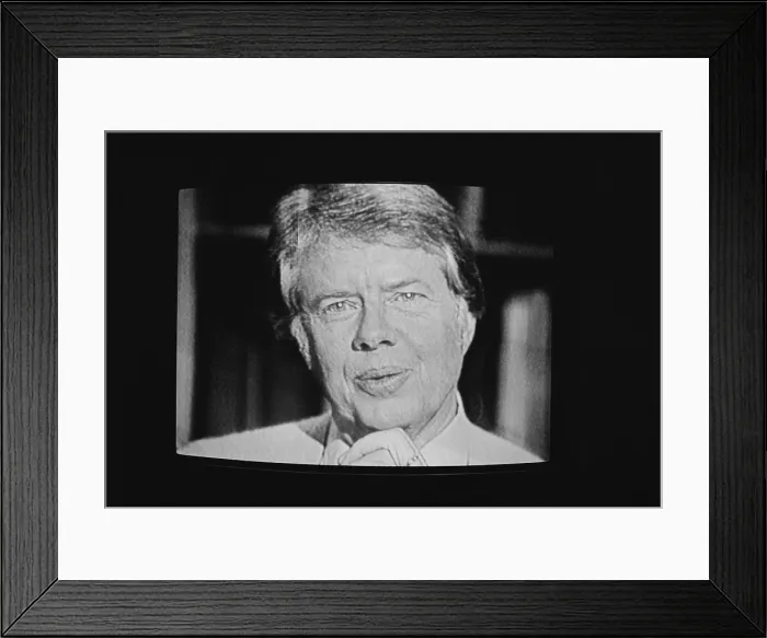 Framed Print : President Carter worn a cardigan sweater for his first televised fireside chat from the White House starting a joking reference to him as Jimmy Cardigan'. Feb.2 1977