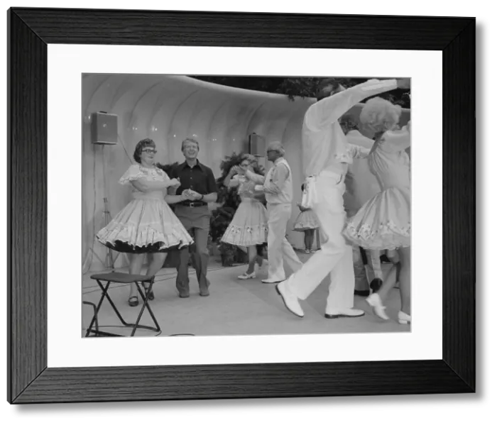 Framed Print : Jimmy Carter square dances during a Congressional Picnic on the South Lawn. Ca. 1977-1980