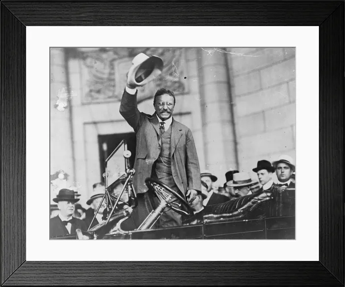 Framed Print : Theodore Roosevelt, waving his hat, as he stands in car. Ca. 1910 Framed Print : Theodore Roosevelt, waving his hat, as he stands in car. Ca. 1910