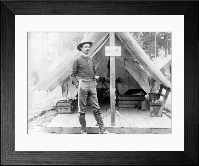 Framed Print : Buffalo soldier. T.R. Clarke, 8th US Volunteer Infantry, standing in front of tent, during the Spanish-American War. ca. 1898 Framed Print : Buffalo soldier. T.R. Clarke, 8th US Volunteer Infantry, standing in front of tent, during the Spanish-American War. ca. 1898
