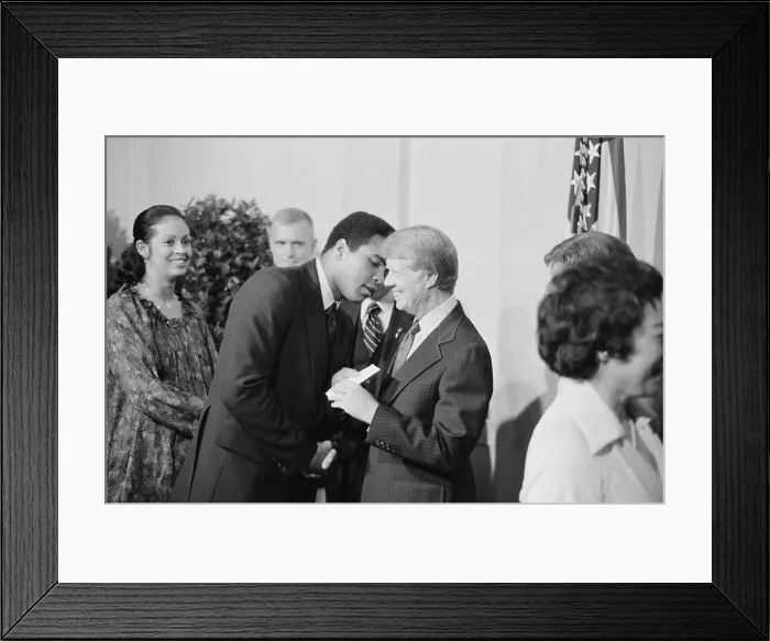 Framed Print : President Jimmy Carter greets Muhammad Ali at a White House dinner celebrating the signing of the Panama Canal Treaty. Sept. 7 1978