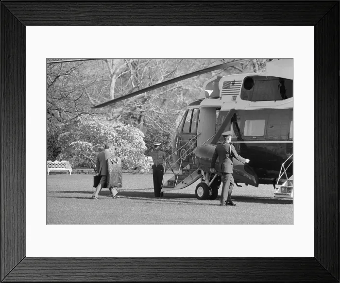 Framed Print : President Jimmy Carter walking toward Marine 1 the Presidential helicopter carrying his own luggage. Ca. 1977-80