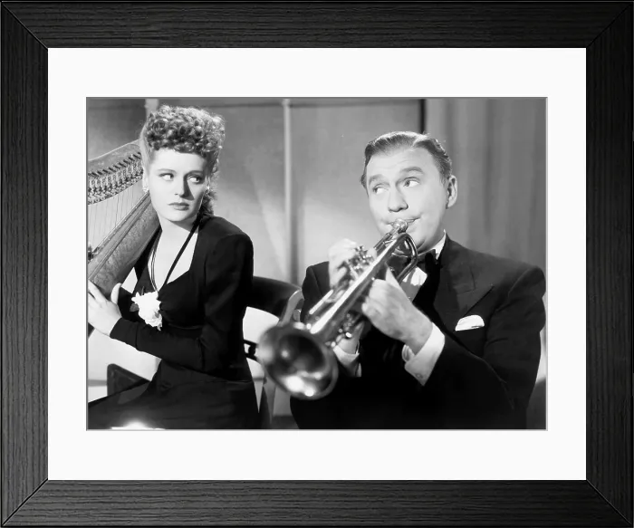 Framed Print : THE HORN BLOWS AT MIDNIGHT, from left, Alexis Smith, Jack Benny, 1945