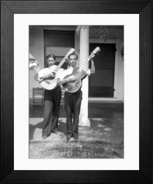 Framed Print : Folk Music. Lolo Mendoza and Chico Real, with guitars, at the home of Mrs. Sarah Kleberg Shelton, Kingsville, Texas. Ruby Lomax, photographer, 1940