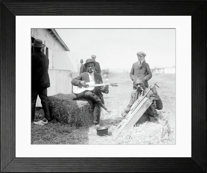 Framed Print : Folk Music. Two musicians sitting on bales of hay and playing instruments outside a barn, ca. 1918 Framed Print : Folk Music. Two musicians sitting on bales of hay and playing instruments outside a barn, ca. 1918