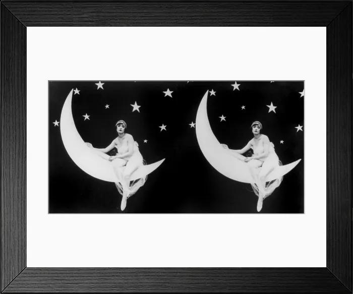 Framed Print : The Girl in the Moon, stereo view of a scantily clad woman sitting in a crescent moon, 1923 Framed Print : The Girl in the Moon, stereo view of a scantily clad woman sitting in a crescent moon, 1923