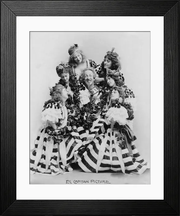 Framed Print : DeWolf Hopper, (1858-1935) surrounded by six women, all in costume, starring in Sousa's El Capitan