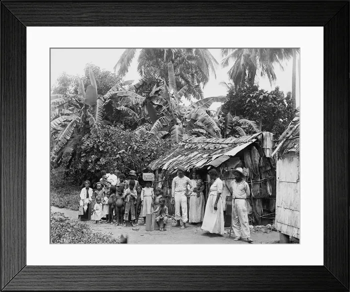 Framed Print : Puerto Ricans in front of a primitive dwelling shortly after Puerto Rico was annexed by the United States after the Spanish American war. Ca. 1903